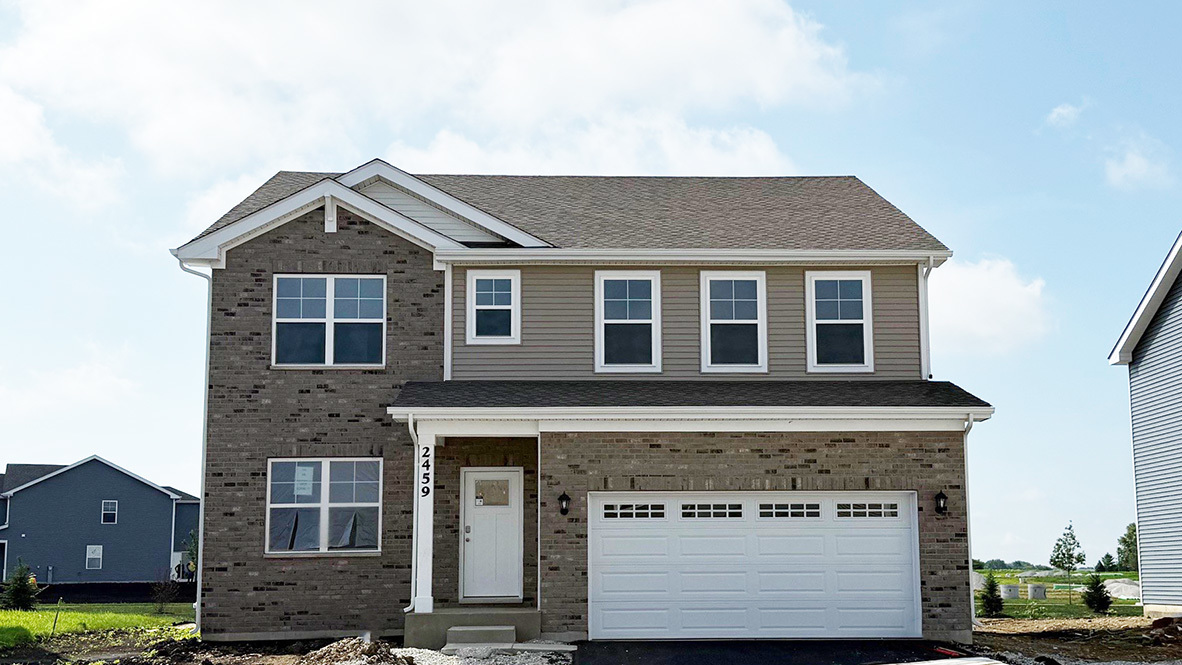 2459 Scribe Street Oswego, IL 60543 - Photo 27 of 27 a front view of a house with a yard