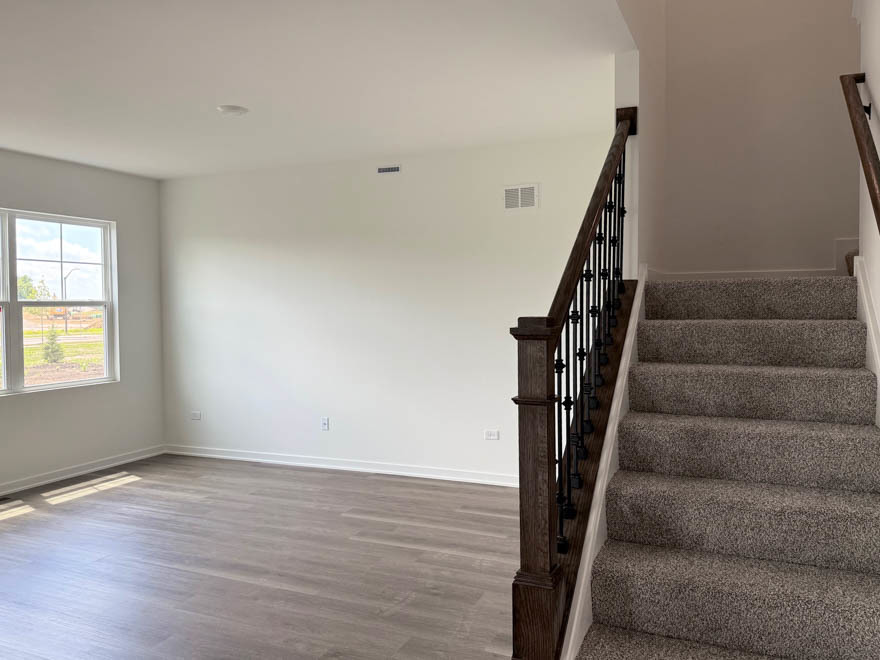 2459 Scribe Street Oswego, IL 60543 - Photo 3 of 27 a view of entryway with wooden floor and stairs
