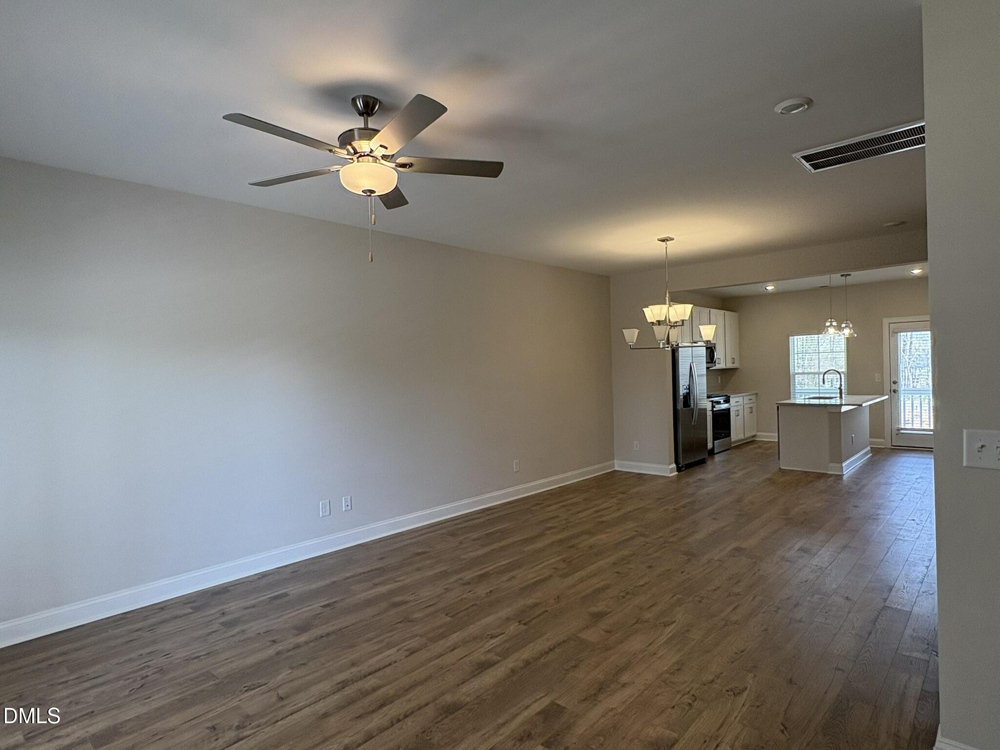 521 Forestville Road Wake Forest, NC 27587 - Photo 3 of 7 a view of empty room with wooden floor