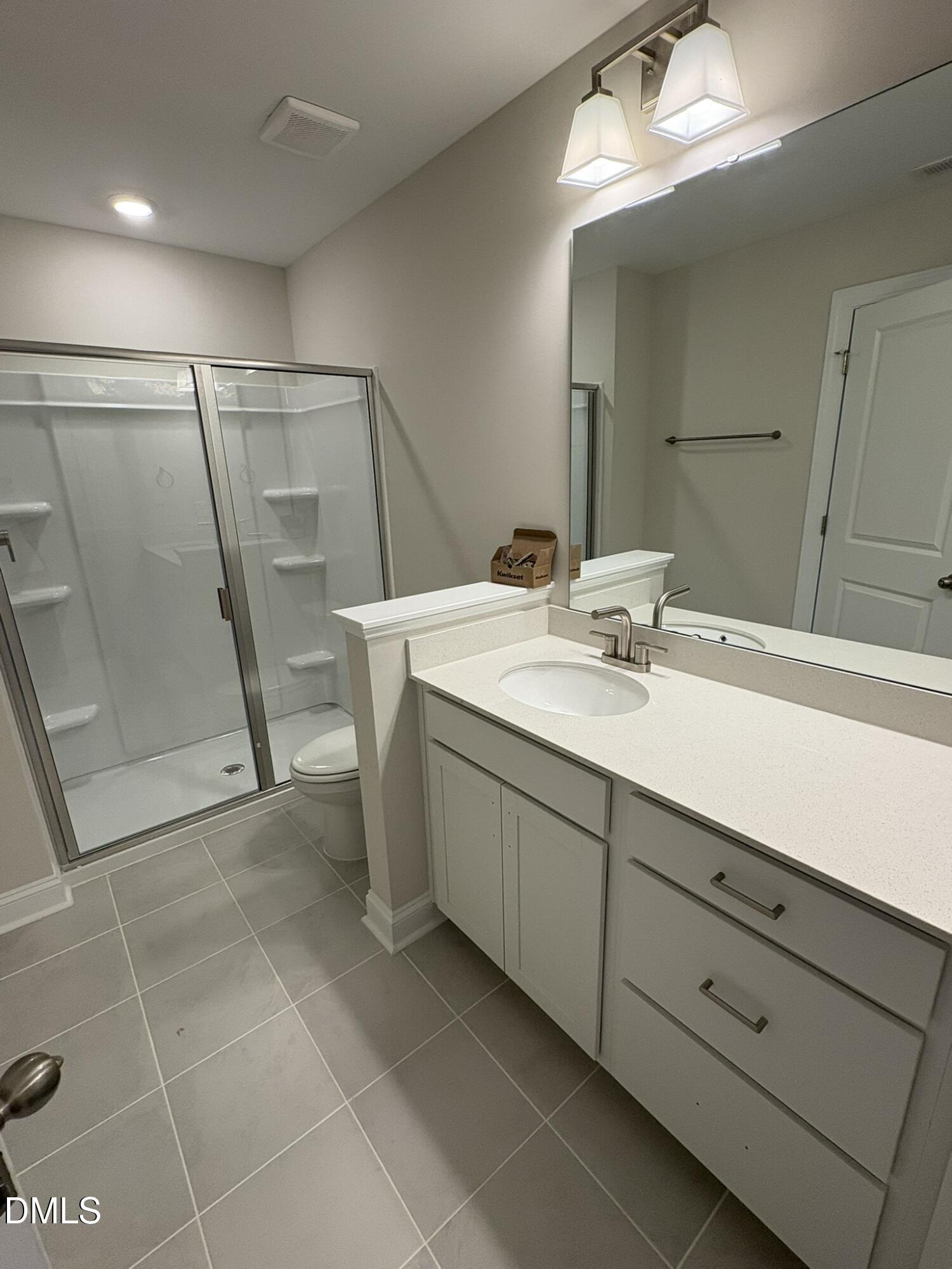 521 Forestville Road Wake Forest, NC 27587 - Photo 6 of 7 a bathroom with a sink a vanity and a mirror