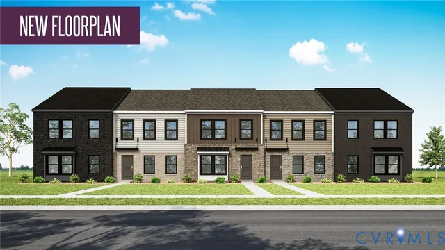 a front view of a residential apartment building with a yard