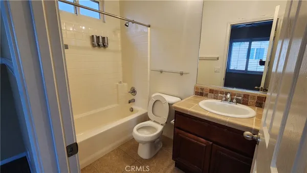 a bathroom with a sink toilet a shower and a mirror