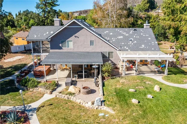 an aerial view of residential house with outdoor space