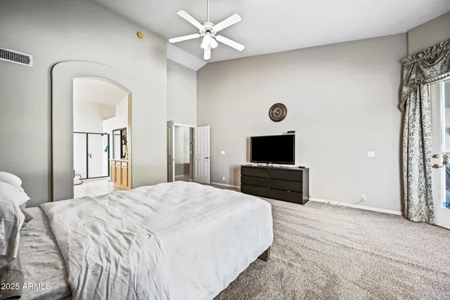 a bathroom with a double vanity sink toilet and a mirror