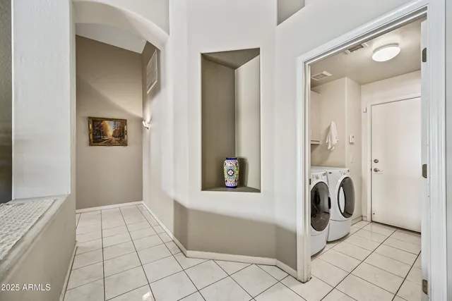 a kitchen with stainless steel appliances granite countertop a sink dishwasher and cabinets with wooden floor