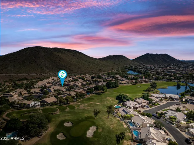 a kitchen with stainless steel appliances granite countertop a sink and a stove