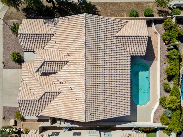 a view of a swimming pool with an outdoor seating