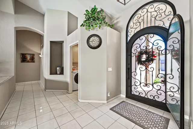 a view of walk in closet with clothes
