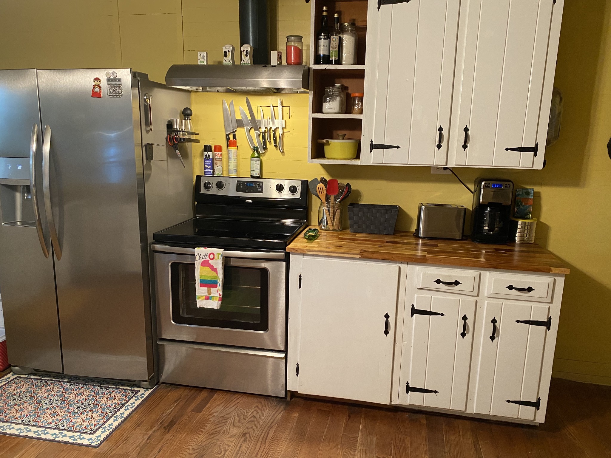 3104 Highway 41 Pelham, TN 37366 - Photo 7 of 16 a kitchen with stainless steel appliances granite countertop a stove a refrigerator and a microwave