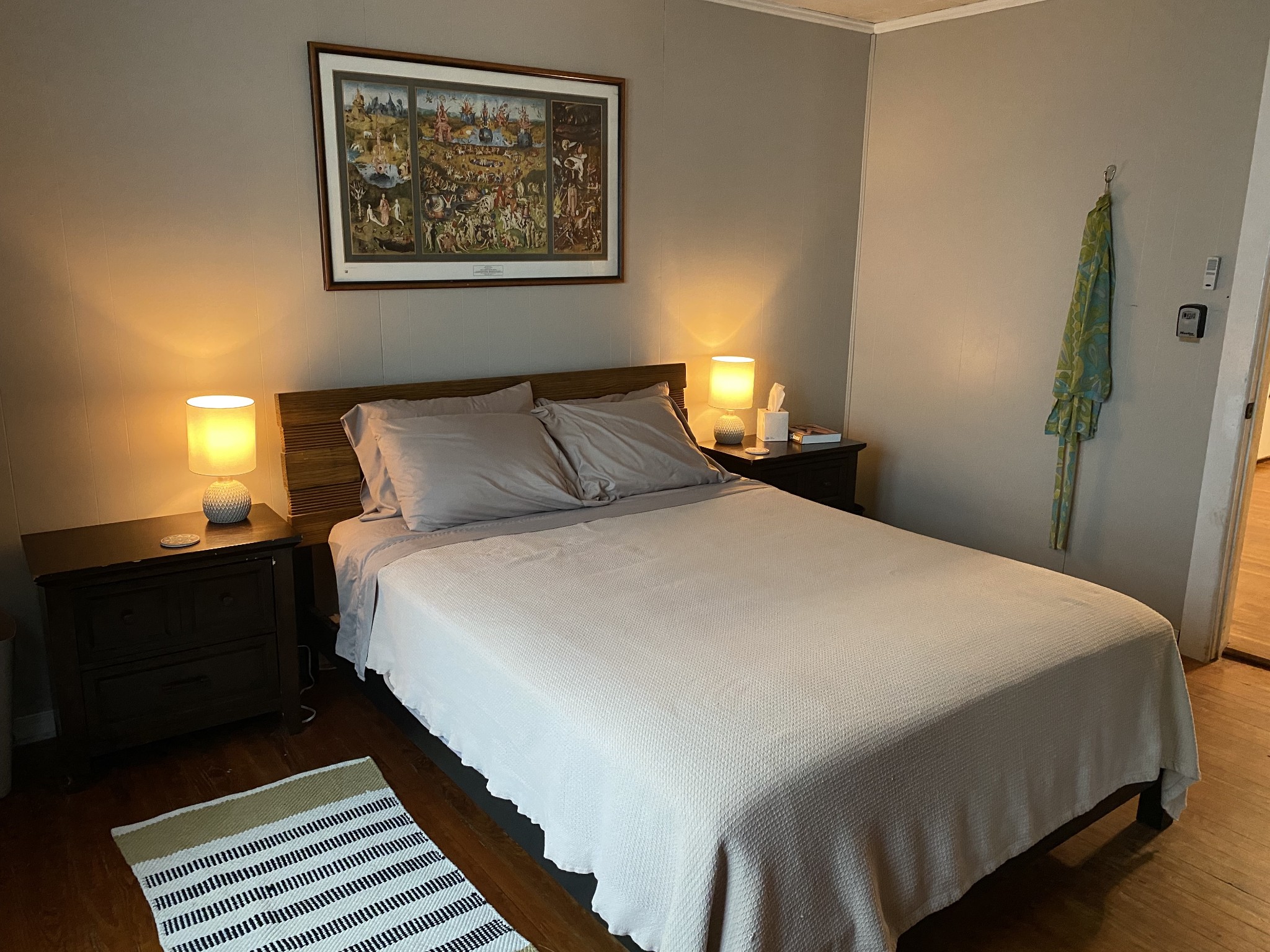 3104 Highway 41 Pelham, TN 37366 - Photo 10 of 16 a bedroom with bed and paintings on the wall