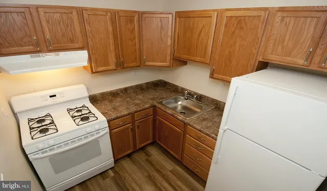 a kitchen with a stove and a cabinet