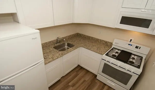 a kitchen with a stove and a microwave