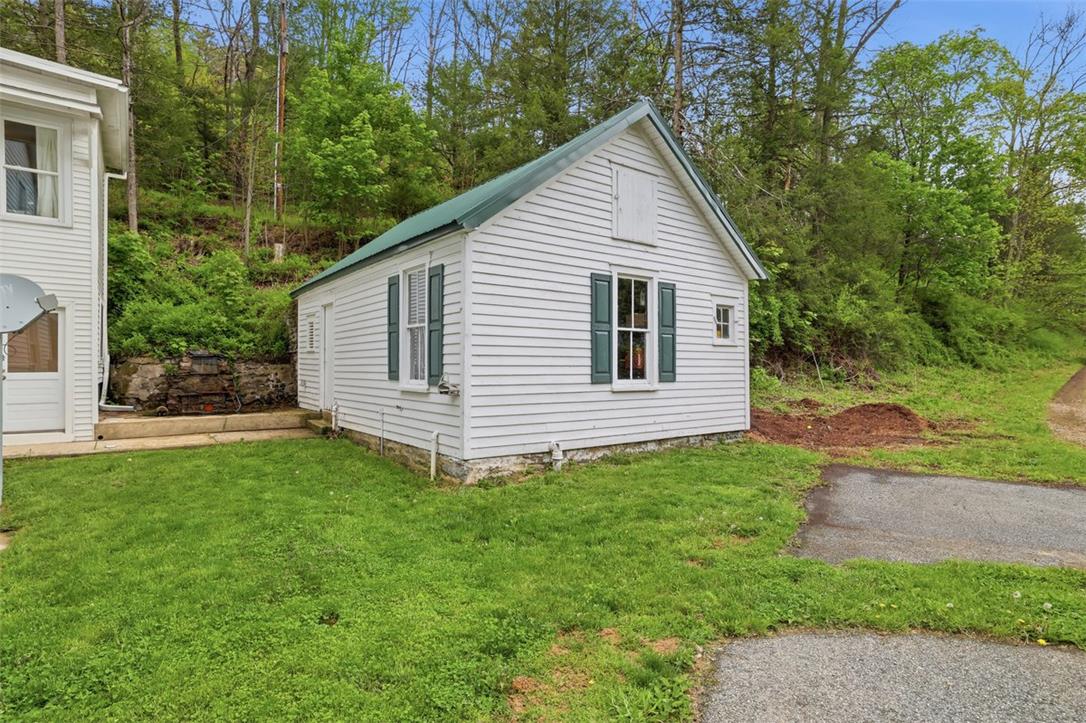 3585 Fairyland Road Lehighton, PA 18235 - Photo 6 of 57 a view of a backyard with plants and large tree