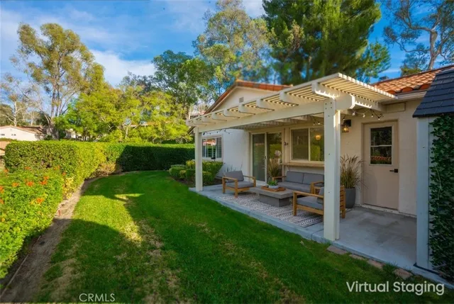 a view of a house with backyard porch and garden
