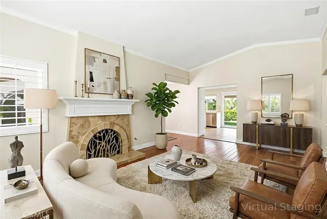 a living room with furniture and a fireplace