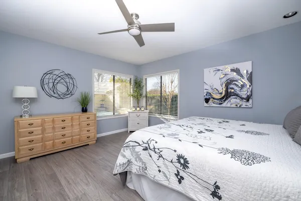 a room with a dresser and a window