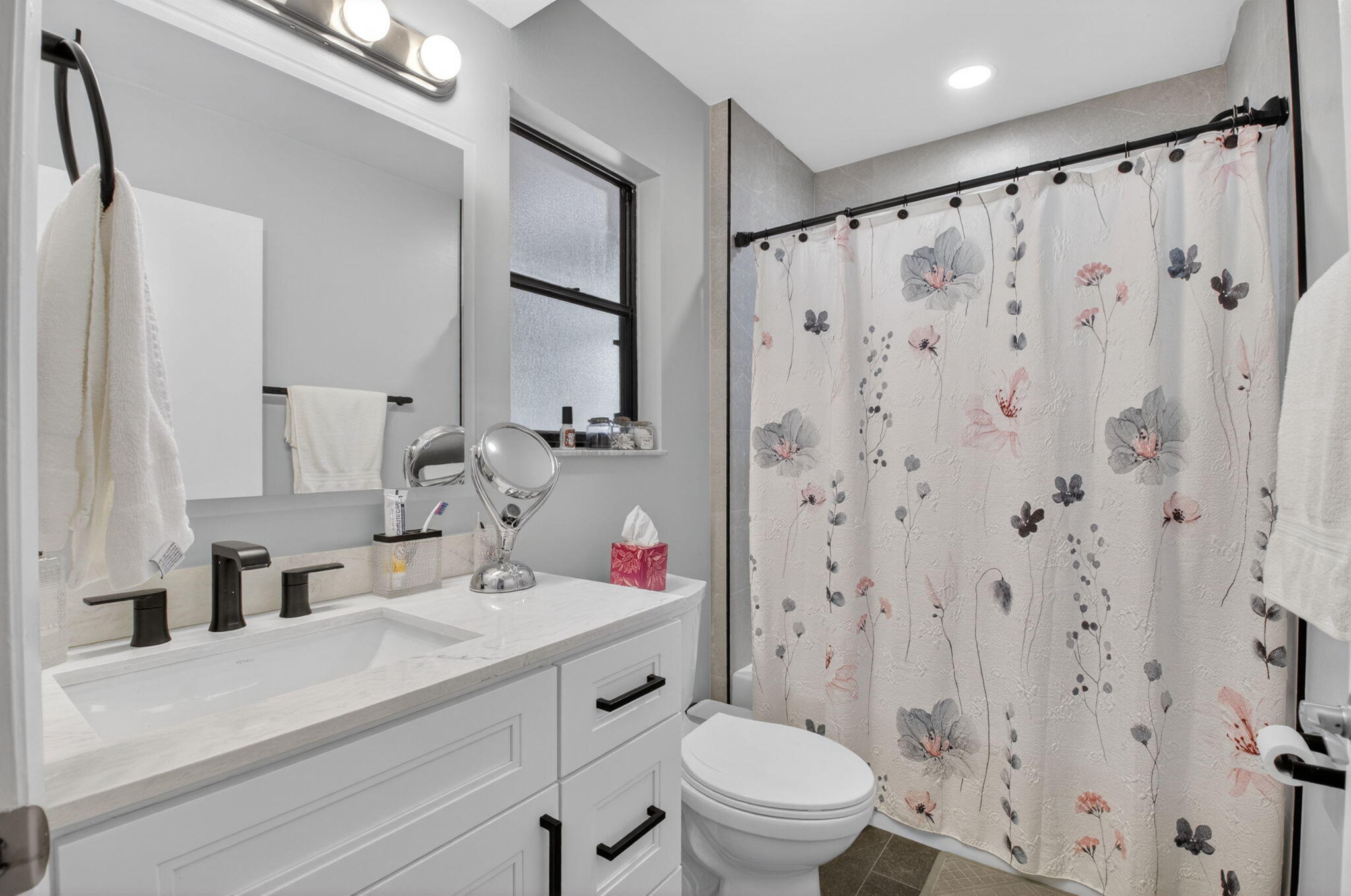 2360 Northwest 12th Street Delray Beach, FL 33445 - Photo 11 of 62 a bathroom with a sink toilet and shower