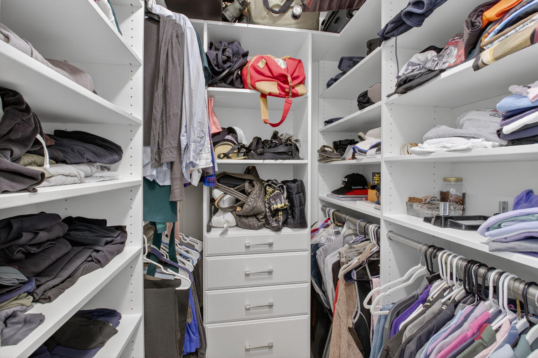 2360 Northwest 12th Street Delray Beach, FL 33445 - Photo 22 of 62 a view of walk in closet with clothes and shoes