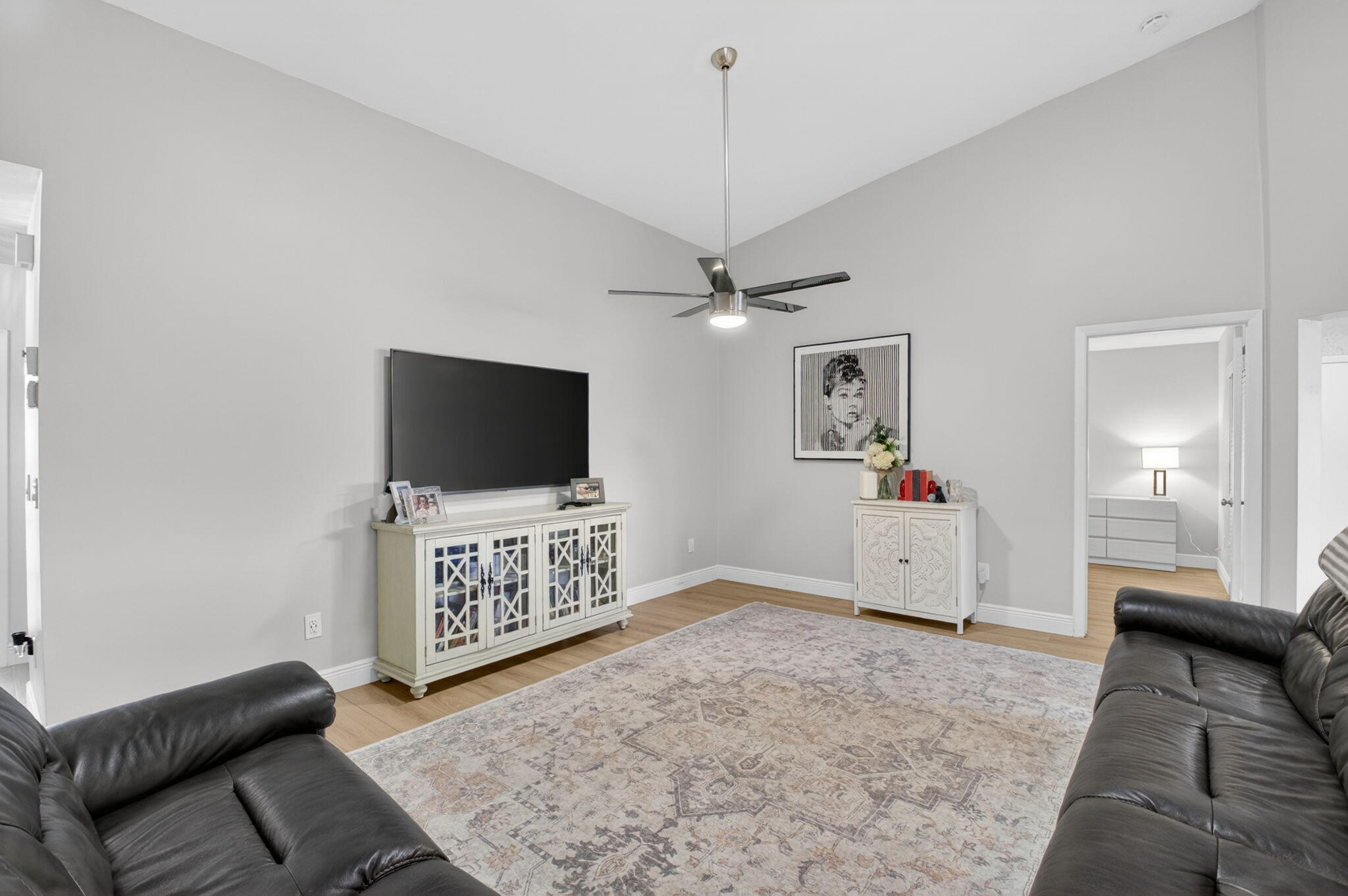 2360 Northwest 12th Street Delray Beach, FL 33445 - Photo 7 of 62 a living room with furniture and a flat screen tv