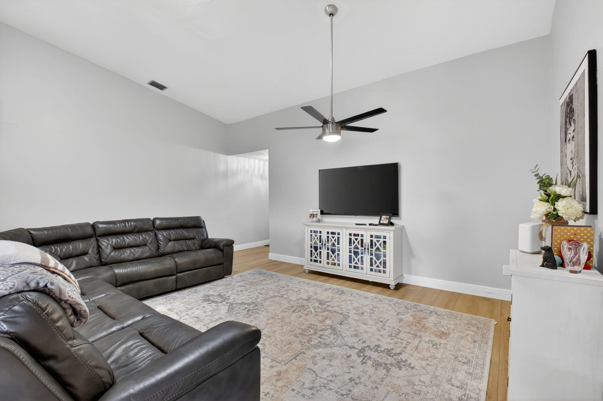 2360 Northwest 12th Street Delray Beach, FL 33445 - Photo 8 of 62 a living room with furniture and a flat screen tv