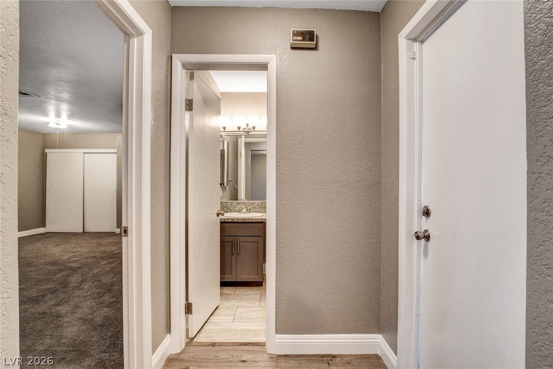 4367 South Mojave Road Las Vegas, NV 89121 - Photo 25 of 53 A well-appointed hallway provides access to a refreshed bathroom and comfortable bedroom space.