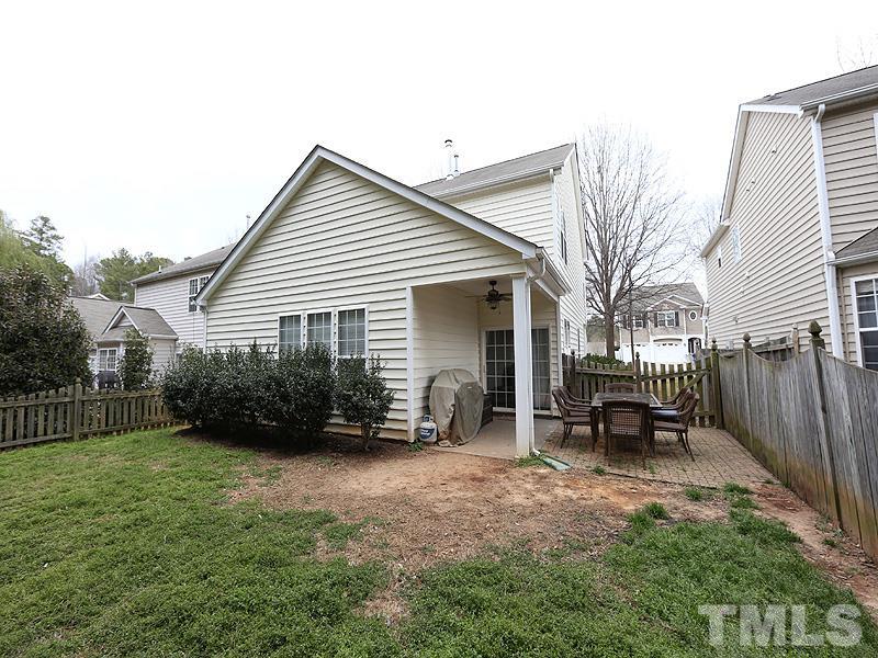 8417 Lunar Stone Place Raleigh, NC 27613 - Photo 14 of 15 a view of a house with backyard and a chairs