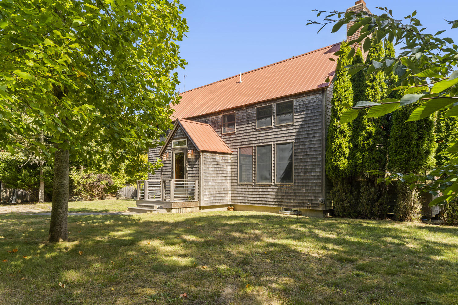 a front view of a house with a garden