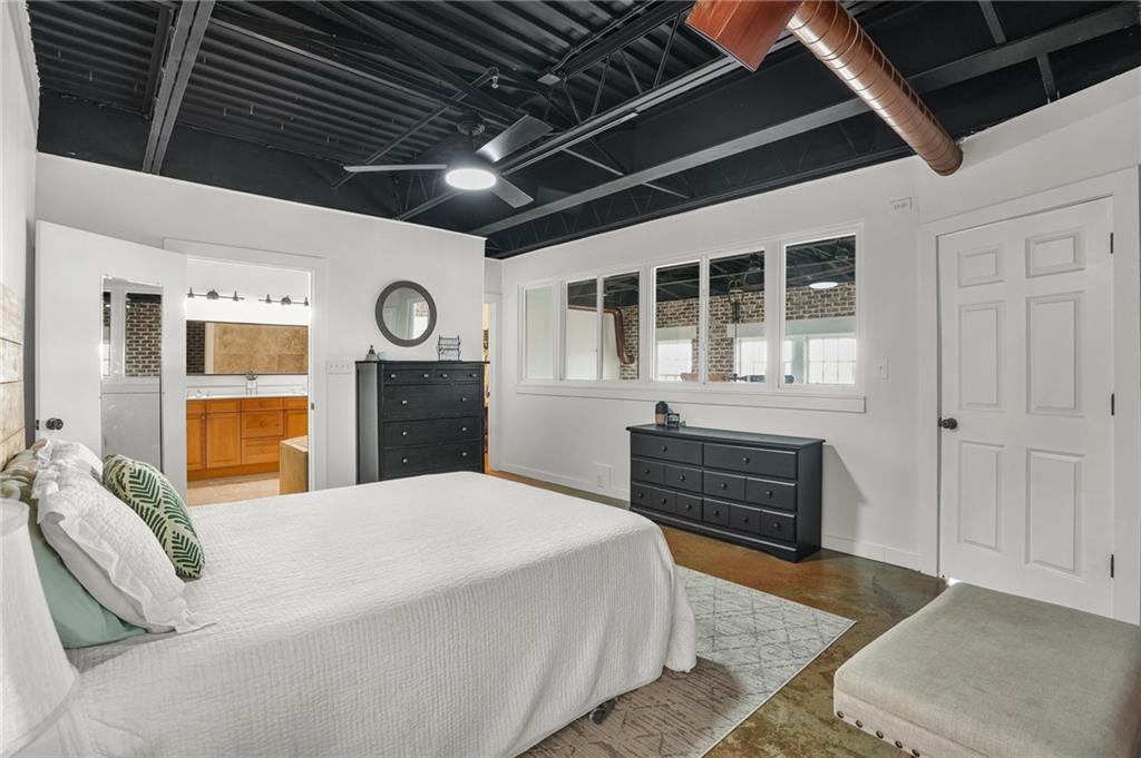 5434 Peachtree Road, Unit 119 Atlanta, GA 30341 - Photo 20 of 44 a bed room with a bed and a dresser