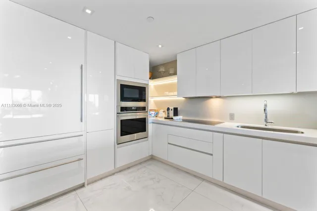 a spacious bedroom with a bed and wooden floor