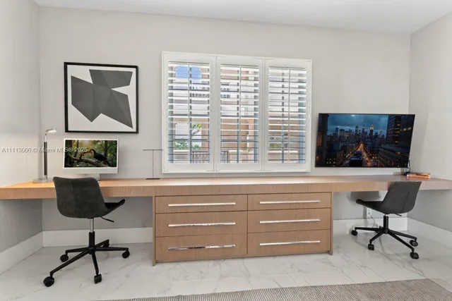 a view of a bathroom with a tub shower and mirror