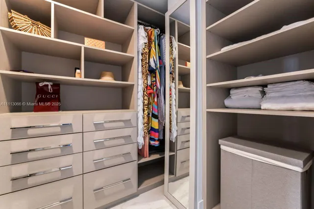 front view of a building with palm trees