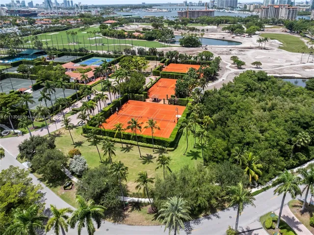 a bathroom with a sink mirror and a shower