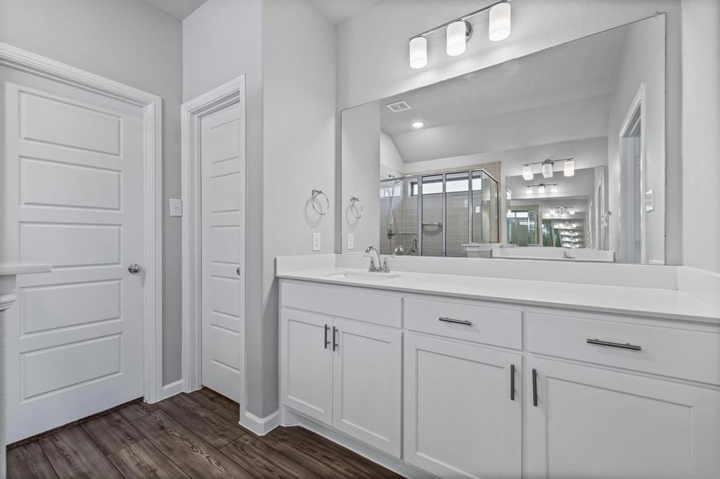 620 Shade Tree Way Princeton, TX 75407 - Photo 19 of 35 a bathroom with a double vanity sink and mirror