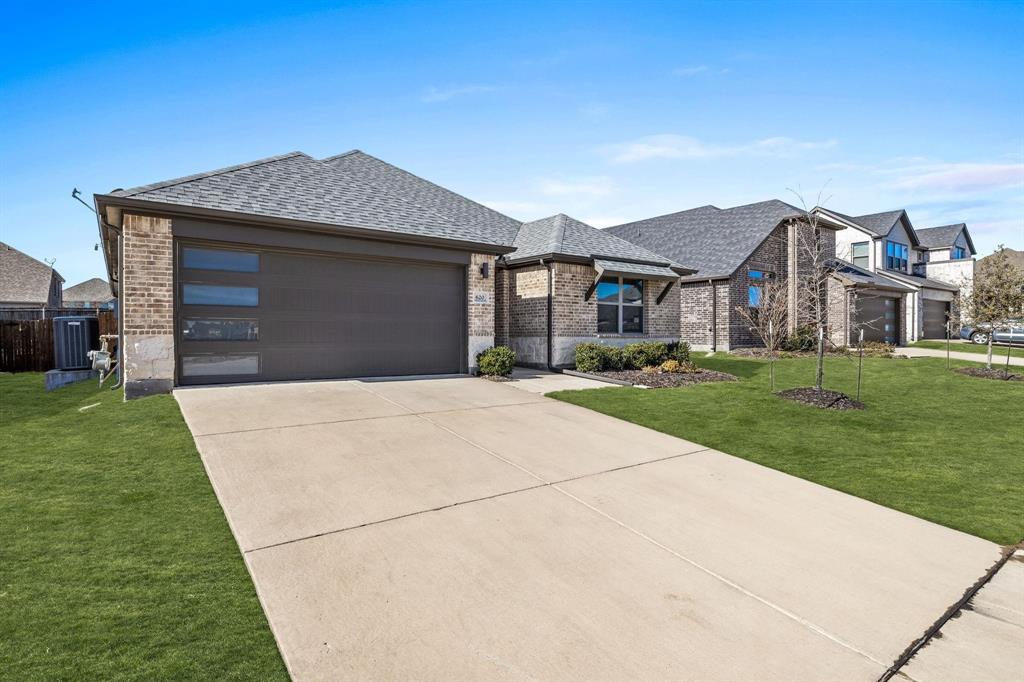 620 Shade Tree Way Princeton, TX 75407 - Photo 2 of 35 a front view of a house with a yard