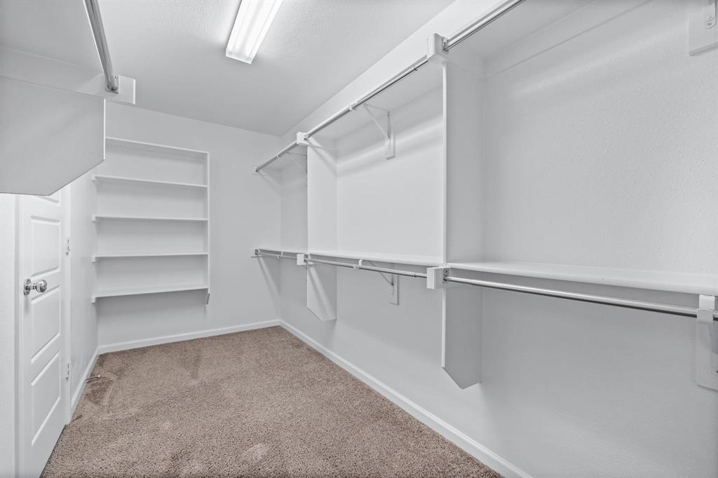 620 Shade Tree Way Princeton, TX 75407 - Photo 23 of 35 a view of an empty walk in closet