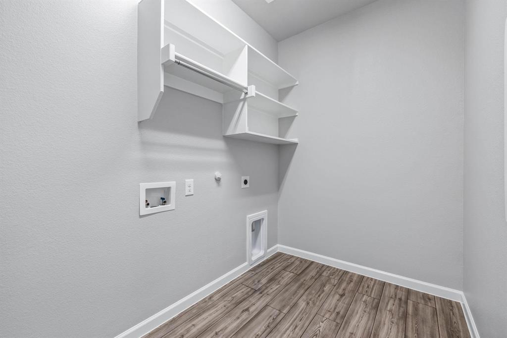 620 Shade Tree Way Princeton, TX 75407 - Photo 27 of 35 a view of a room with rack on the wall