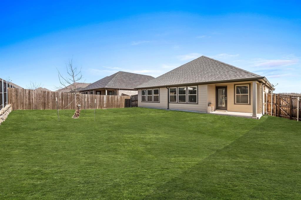 620 Shade Tree Way Princeton, TX 75407 - Photo 31 of 35 a front view of a house with a garden