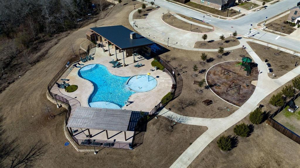 620 Shade Tree Way Princeton, TX 75407 - Photo 35 of 35 an aerial view of a fireplace with table and chairs