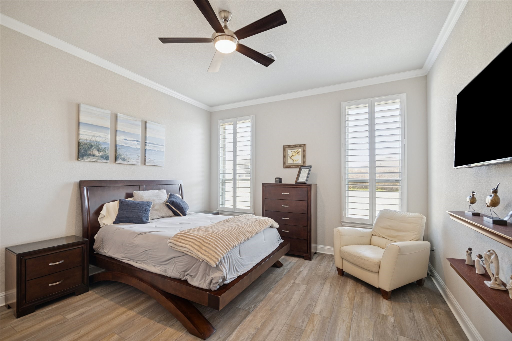 4615 Verbena Valley Way Spring, TX 77388 - Photo 12 of 25 Primary bedroom boasts luxury vinyl plank flooring, crown molding, ceiling fan and lots of natural light.