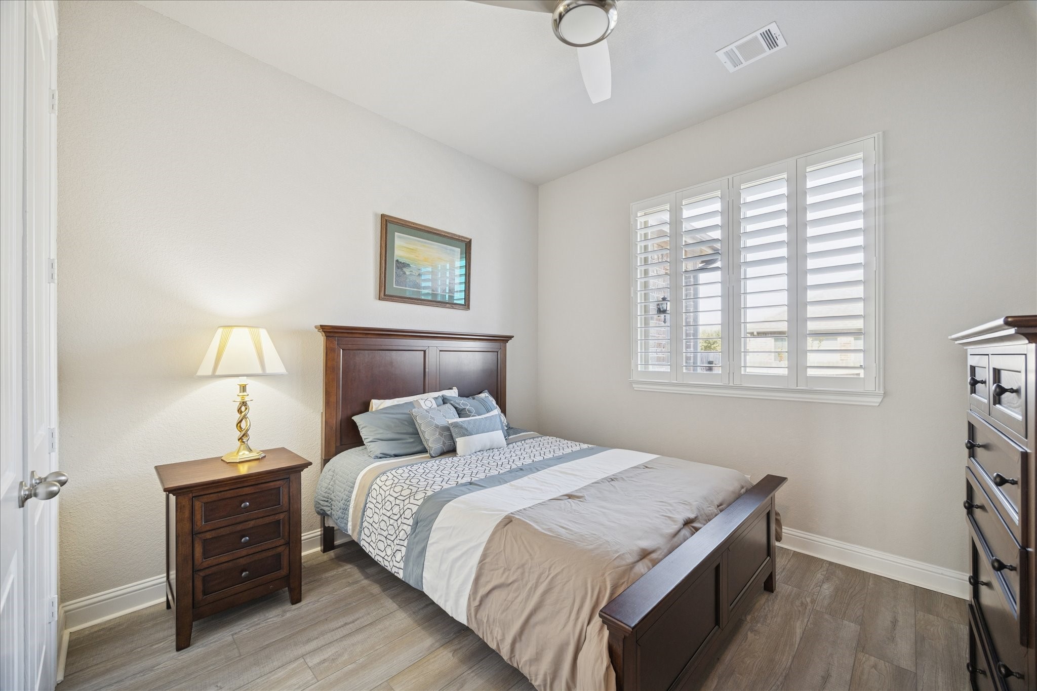 4615 Verbena Valley Way Spring, TX 77388 - Photo 18 of 25 Third bedroom to the left of the entryway. All of the bedrooms are equipped with ceiling fans for sleeping in comfort, natural light through large windows. The plantation shutters when closed make the rooms cozy for napping.