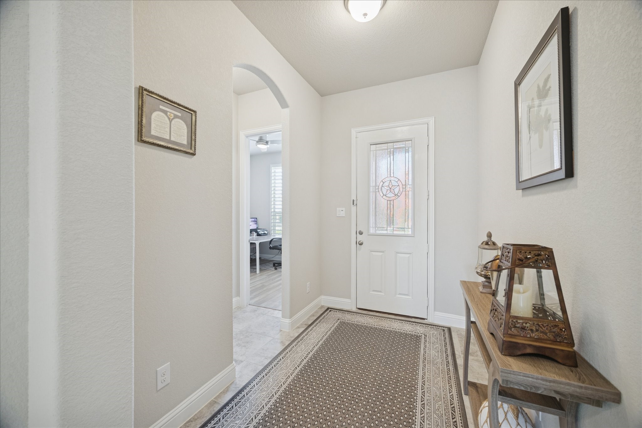 4615 Verbena Valley Way Spring, TX 77388 - Photo 3 of 25 Enter into the formal entryway with tall ceilings and beautiful tile flooring.