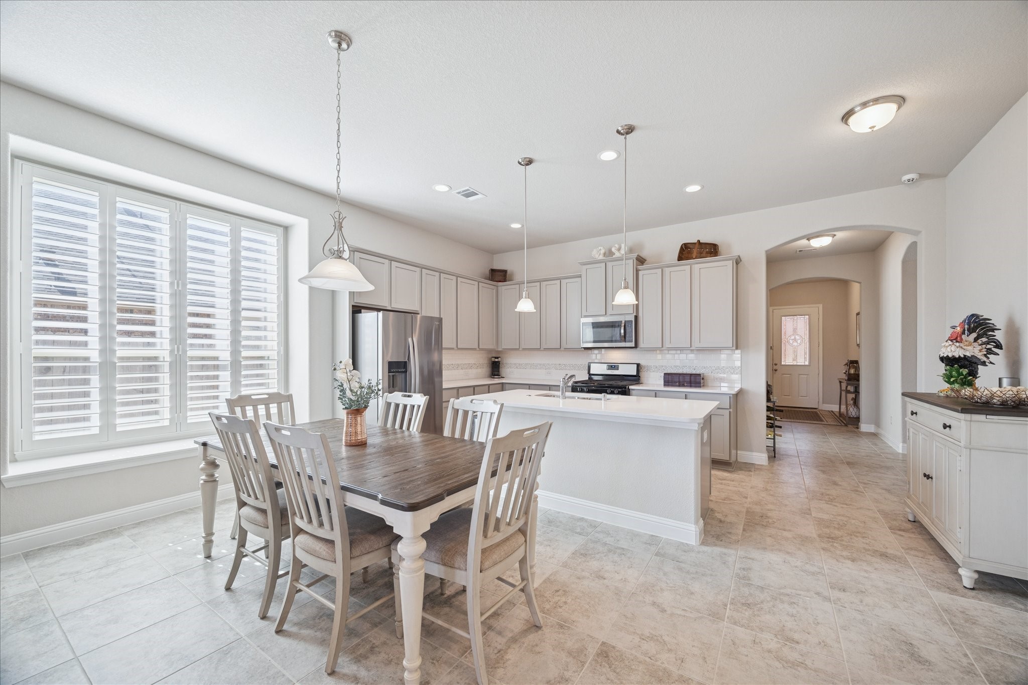 4615 Verbena Valley Way Spring, TX 77388 - Photo 7 of 25 Looking back to the front of the house. Notice that EVERY window has plantation shutters, which saves energy. The neutral colors and beautiful floors invite you further inside the home.