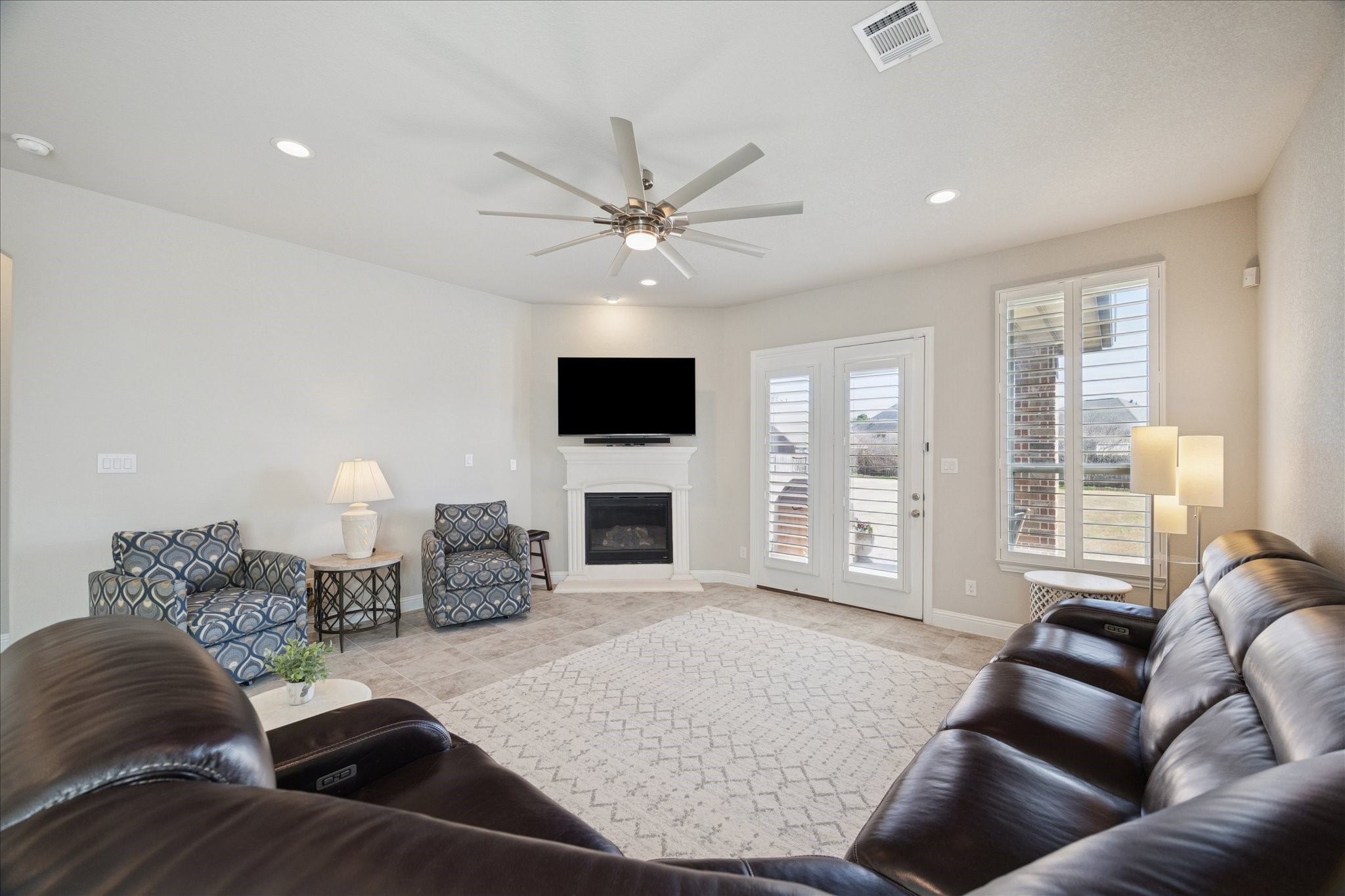 4615 Verbena Valley Way Spring, TX 77388 - Photo 10 of 25 The television mount pulls out and down for perfect viewing of your favorite shows. Gas log fireplace makes the space feel cozy.