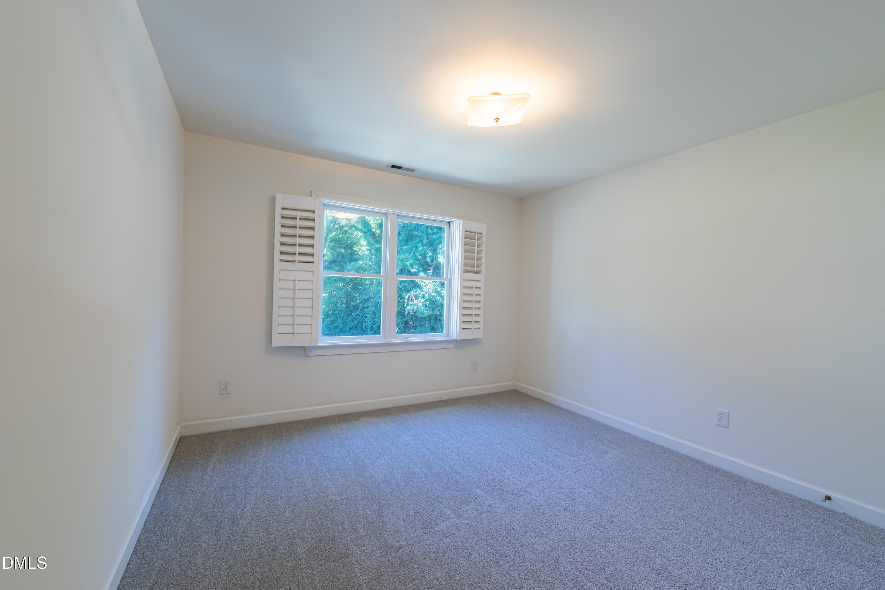 3009 Walton Heath Court Raleigh, NC 27612 - Photo 22 of 40 an empty room with a window