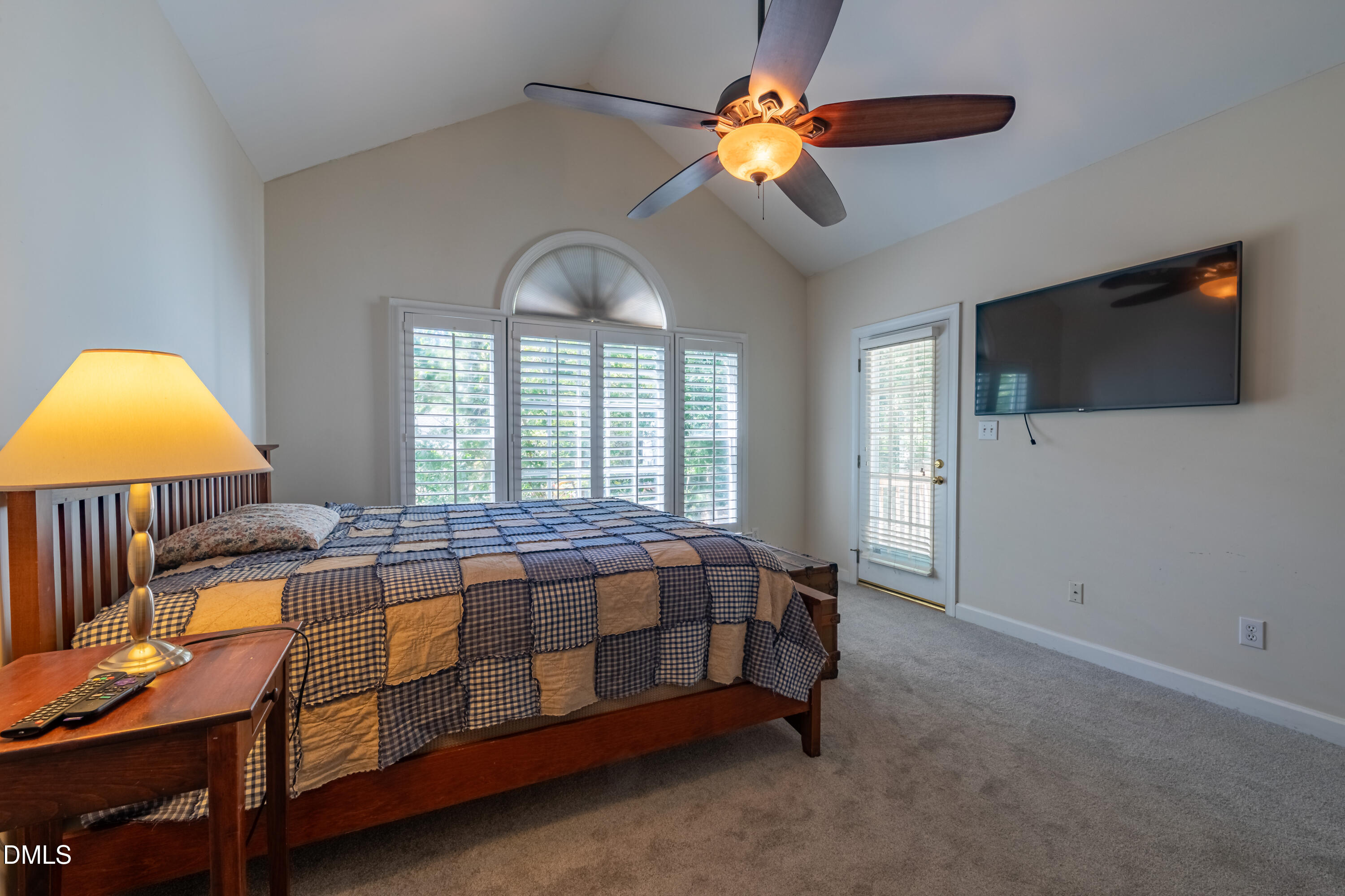 3009 Walton Heath Court Raleigh, NC 27612 - Photo 25 of 40 a bed room with furniture and a flat screen tv