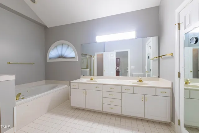 a bathroom with a bathtub and shower