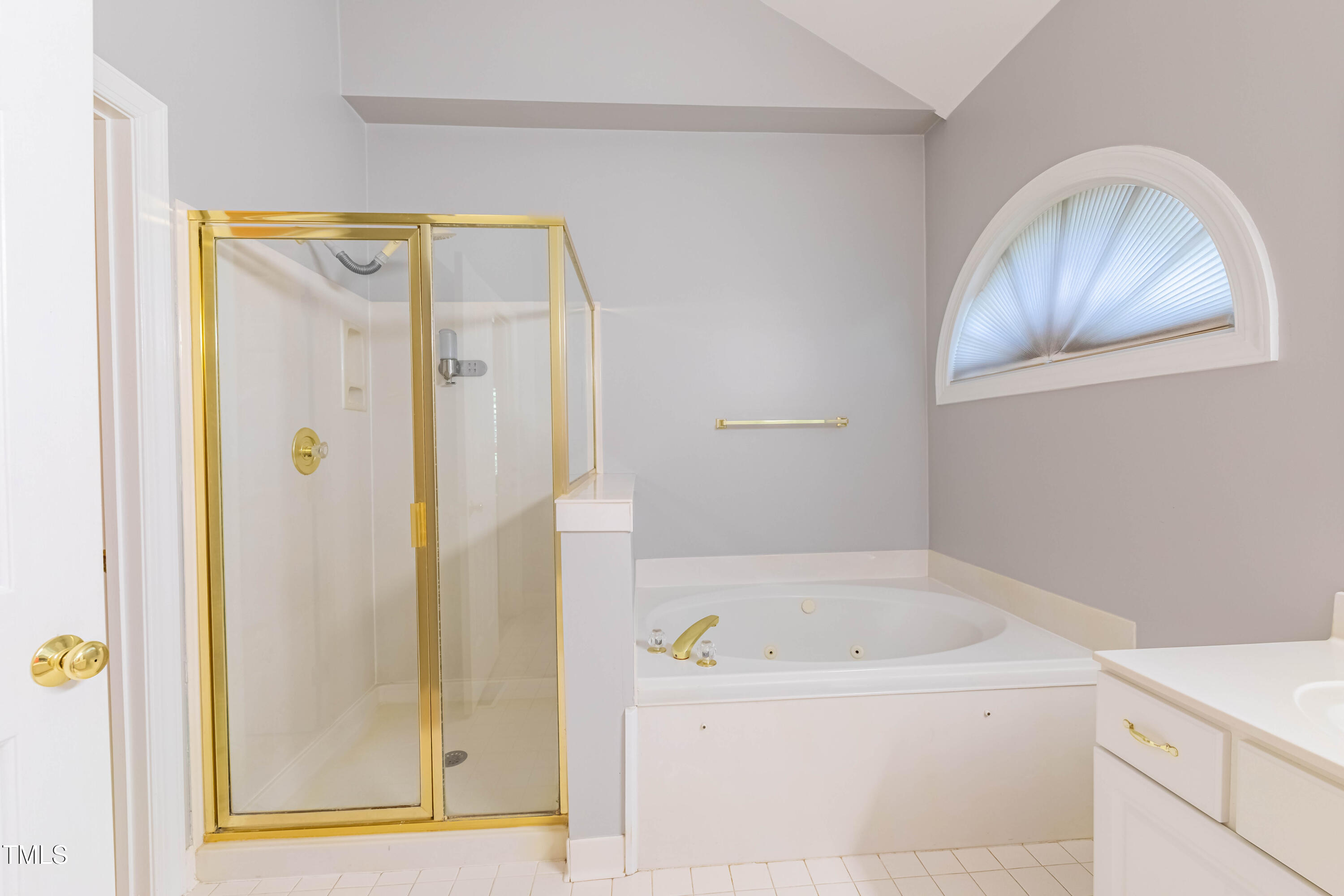 3009 Walton Heath Court Raleigh, NC 27612 - Photo 29 of 40 a bathroom with a bathtub and shower