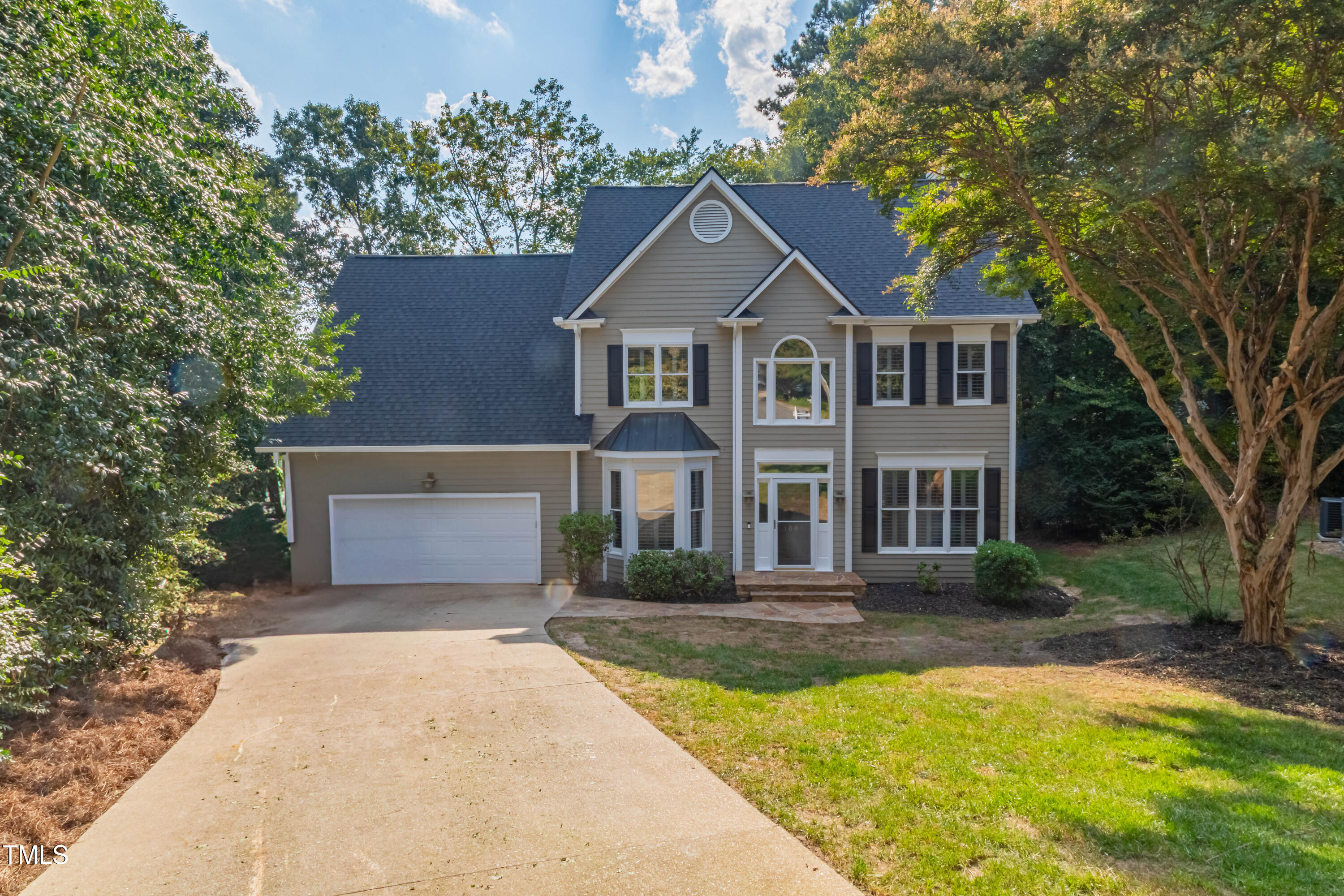 3009 Walton Heath Court Raleigh, NC 27612 - Photo 4 of 40 a front view of a house with a yard and trees