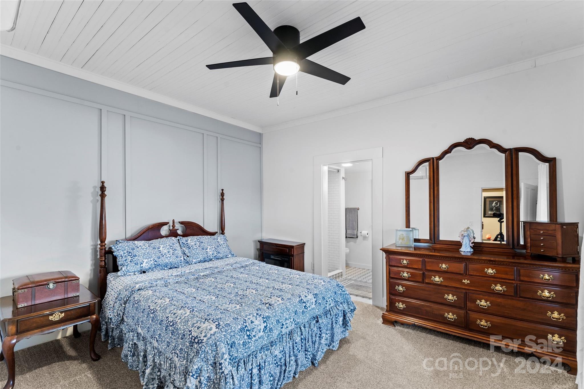 24 Brookside Street Clyde, NC 28721 - Photo 15 of 40 a bedroom with a bed and a dresser