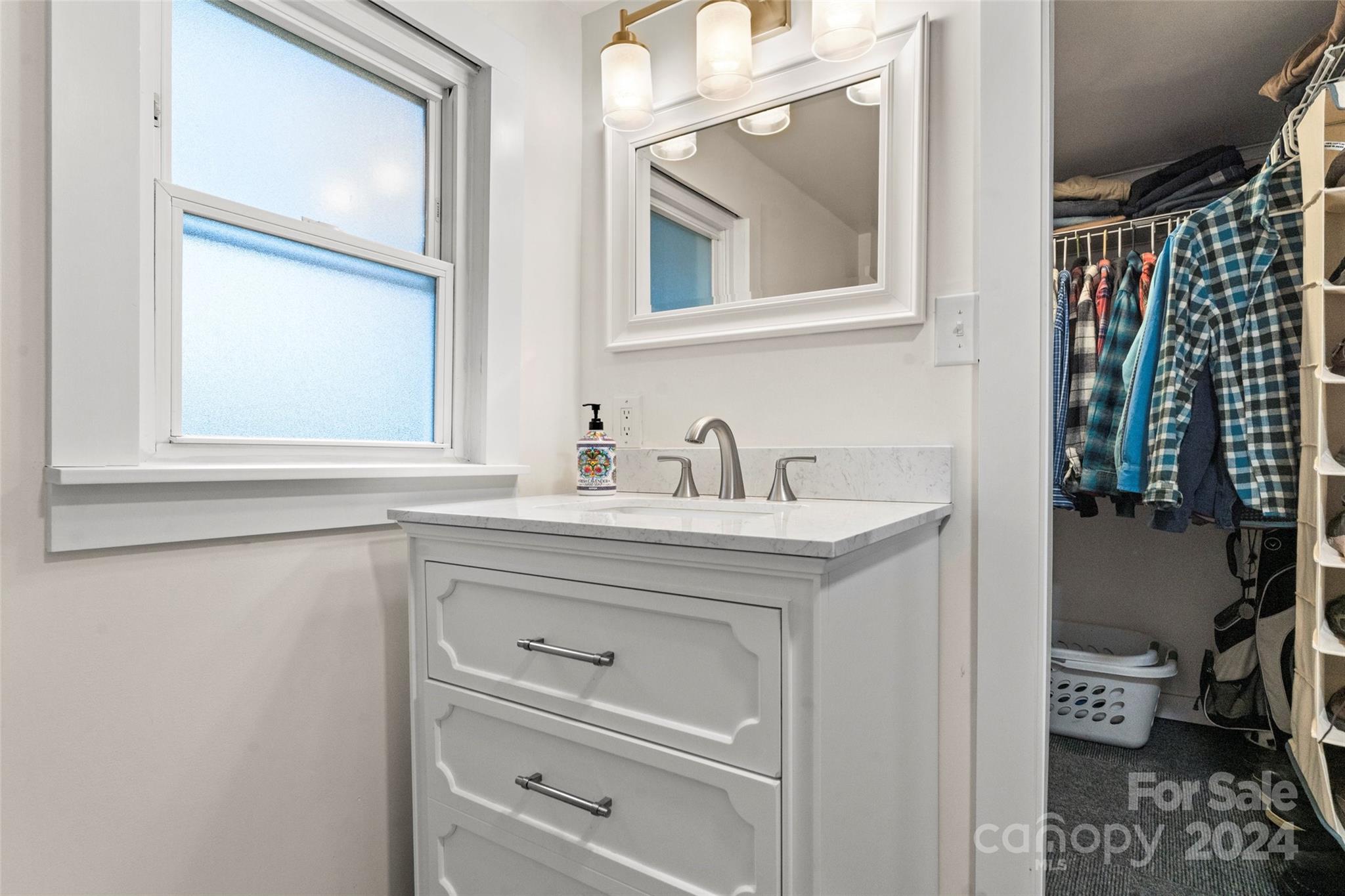 24 Brookside Street Clyde, NC 28721 - Photo 17 of 40 a bathroom with a sink and a mirror